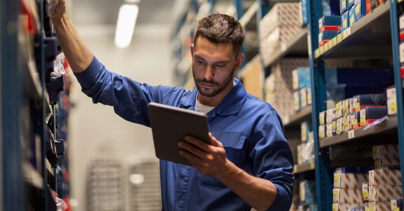 auto mechanic or smith with tablet pc at workshop