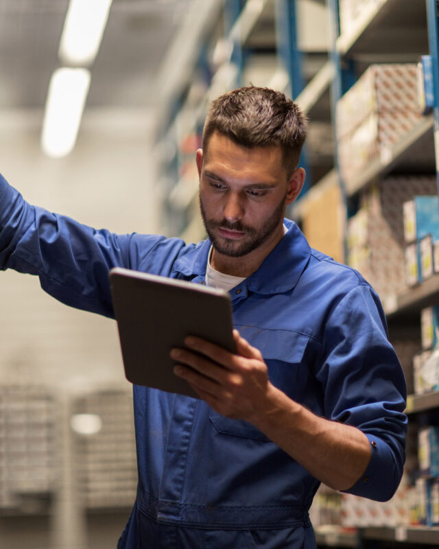 auto mechanic or smith with tablet pc at workshop