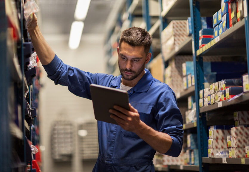 auto mechanic or smith with tablet pc at workshop